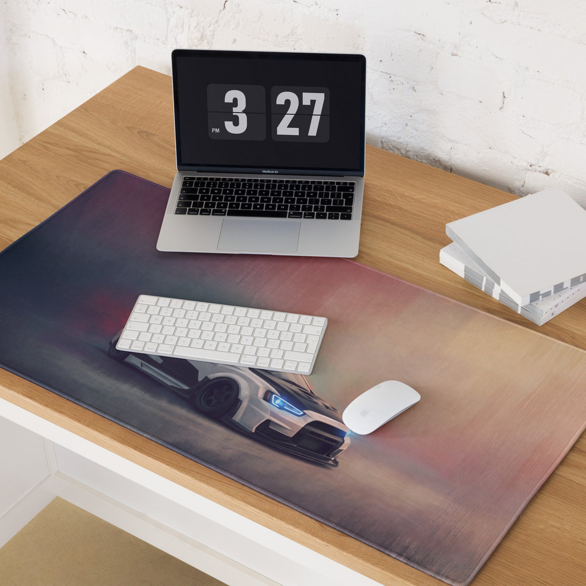 A sleek xl gaming mousepad with a white mitsubishi lancer evolution print and glowing blue headlights on carbon surface