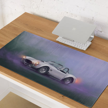 A sleek silver sports car illustration on a soft textured rectangular mousepad with purple and green gradient background