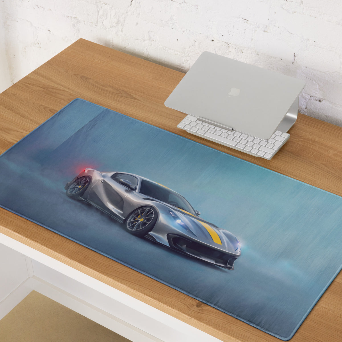 Blue extended non-slip pc mouse mat printed with silver and yellow Ferrari 812 Competizione inspired sports car graphic