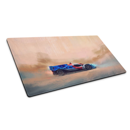 Rectangular desk mat featuring a blue red and white BMW M Hybrid V8 inspired race car on a warm desert background