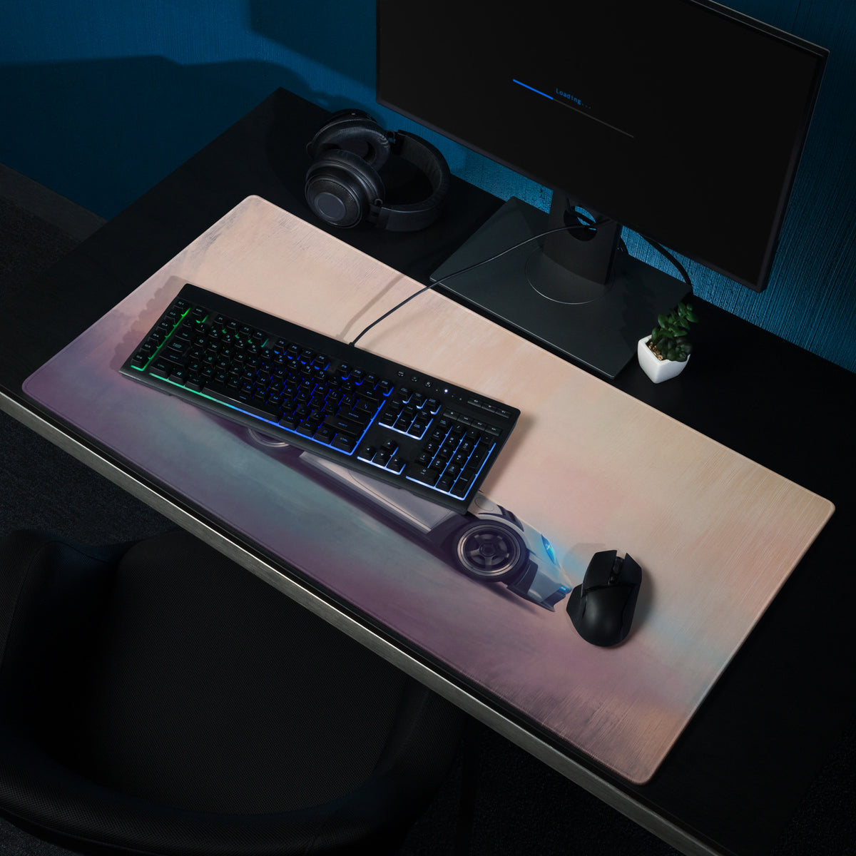 A sleek rectangular silver arrow desk pad with stitched edge and pink blue gradient featuring a futuristic porsche 911 gt3 rs graphic