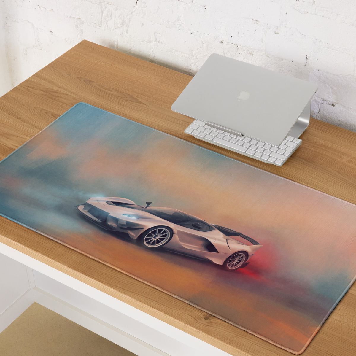A sleek rectangular ferrari fxx-k evo inspired apex edition desk mat with a silver sports car drifting through colorful smoke