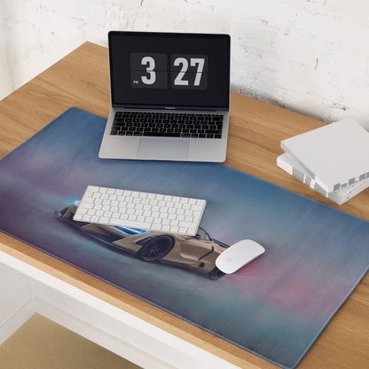 A sleek rectangular non-slip rubber gaming mousepad featuring a detailed Sahara gold McLaren 720S with blue underglow accents