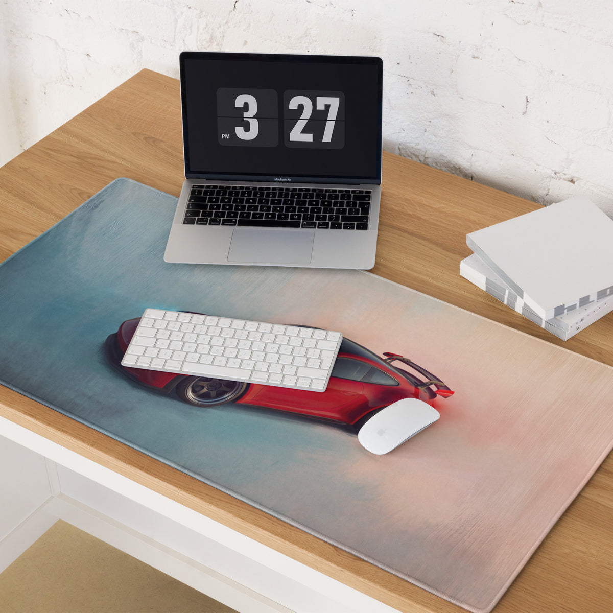 Red sports car graphic on a crimson aerial desk mat with low friction surface for gaming mouse use