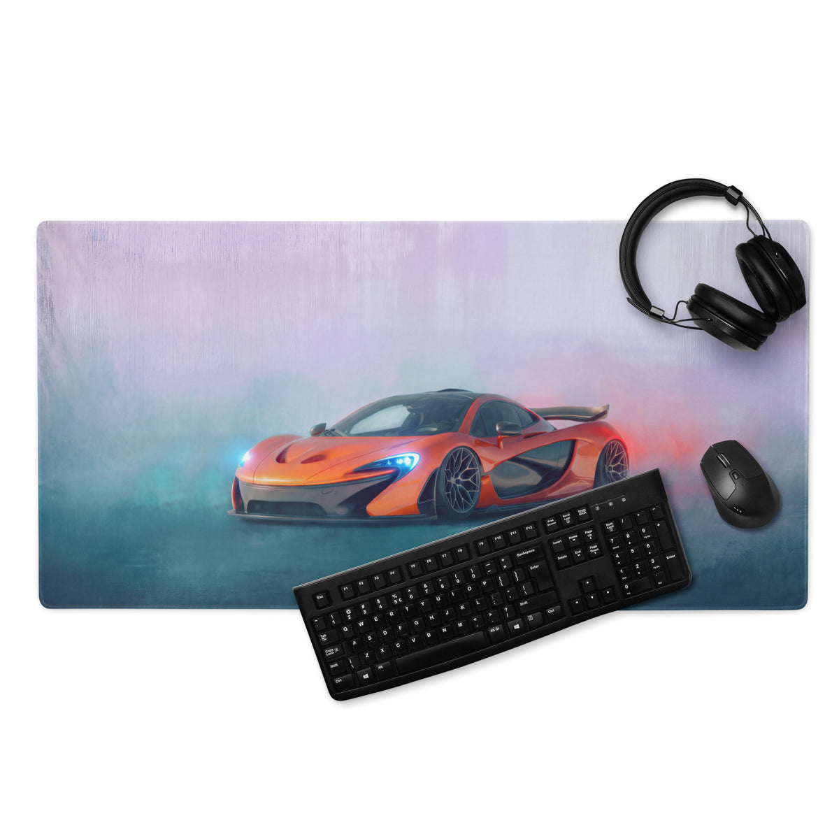 Orange McLaren P1 sports car graphic printed on rectangular extended desk pad with non-slip rubber base mouse mat