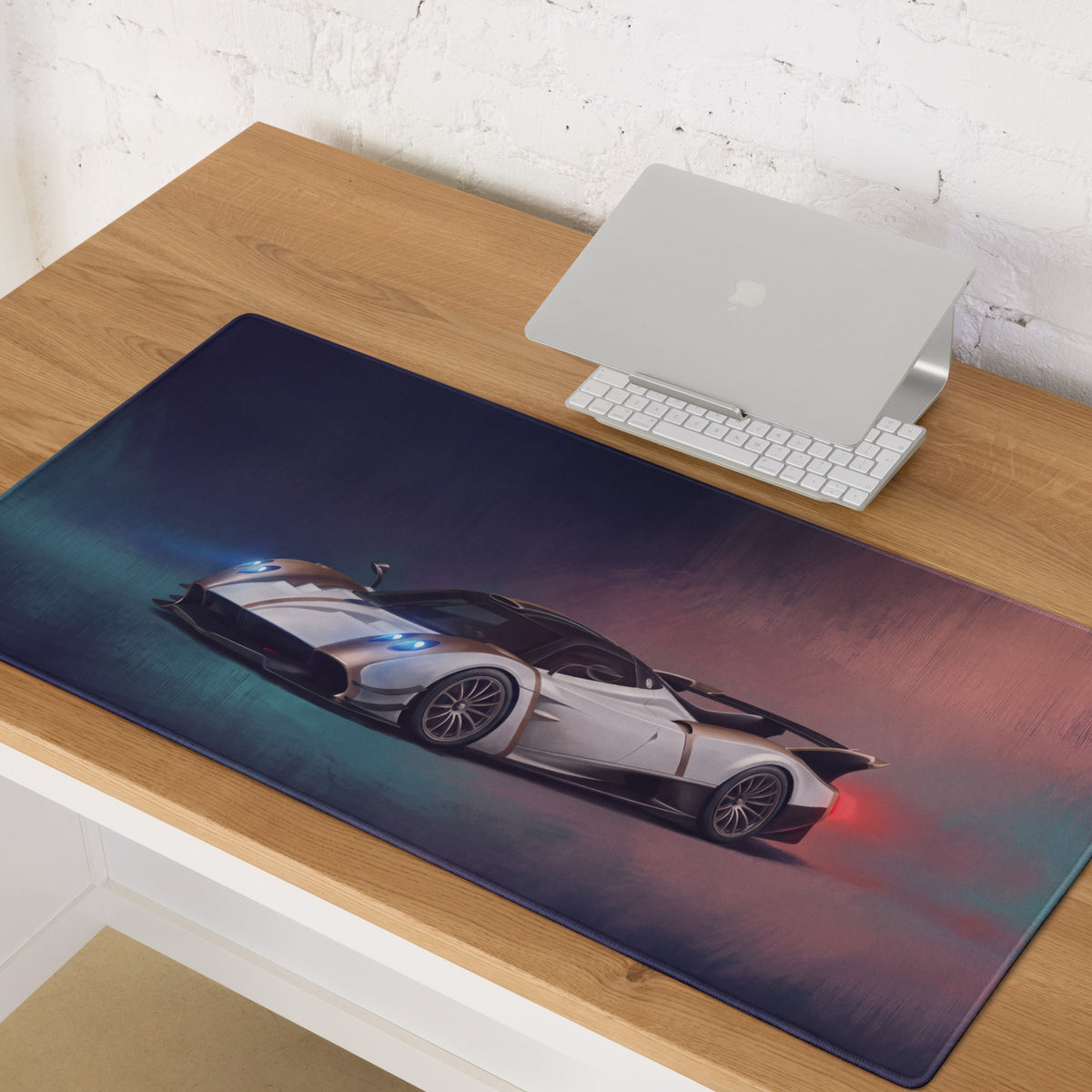 Pagani Huayra R inspired gold accent desk pad featuring a white hypercar illustration with glowing blue headlights