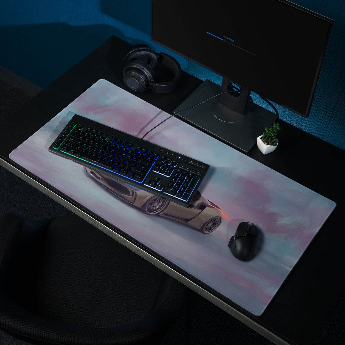 A sleek rectangular titanium gaming mousepad featuring a beige ferrari 296 gts illustration on a pink gradient background