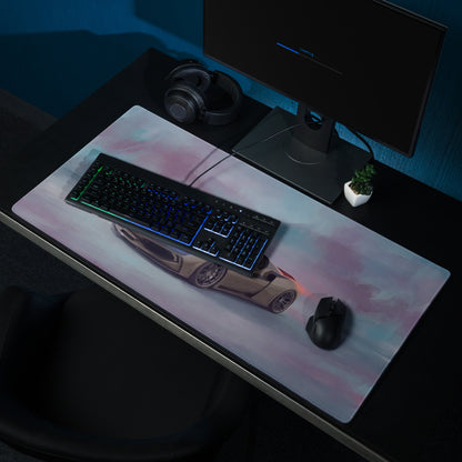 A sleek rectangular titanium gaming mousepad featuring a beige ferrari 296 gts illustration on a pink gradient background