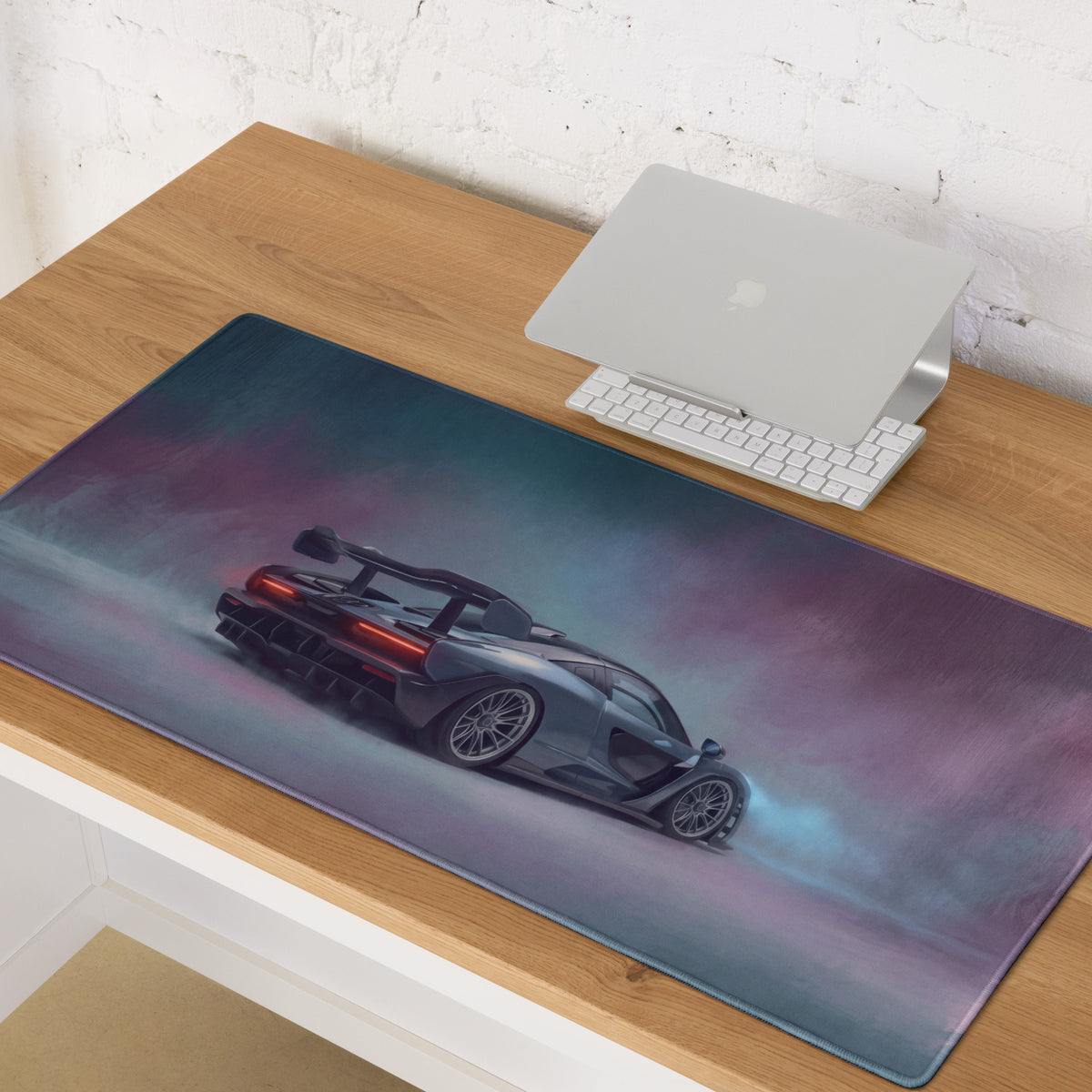 A sleek rectangular ultra-glide xl gaming mouse mat featuring a dark gray mclaren senna with red lights and blue smoke