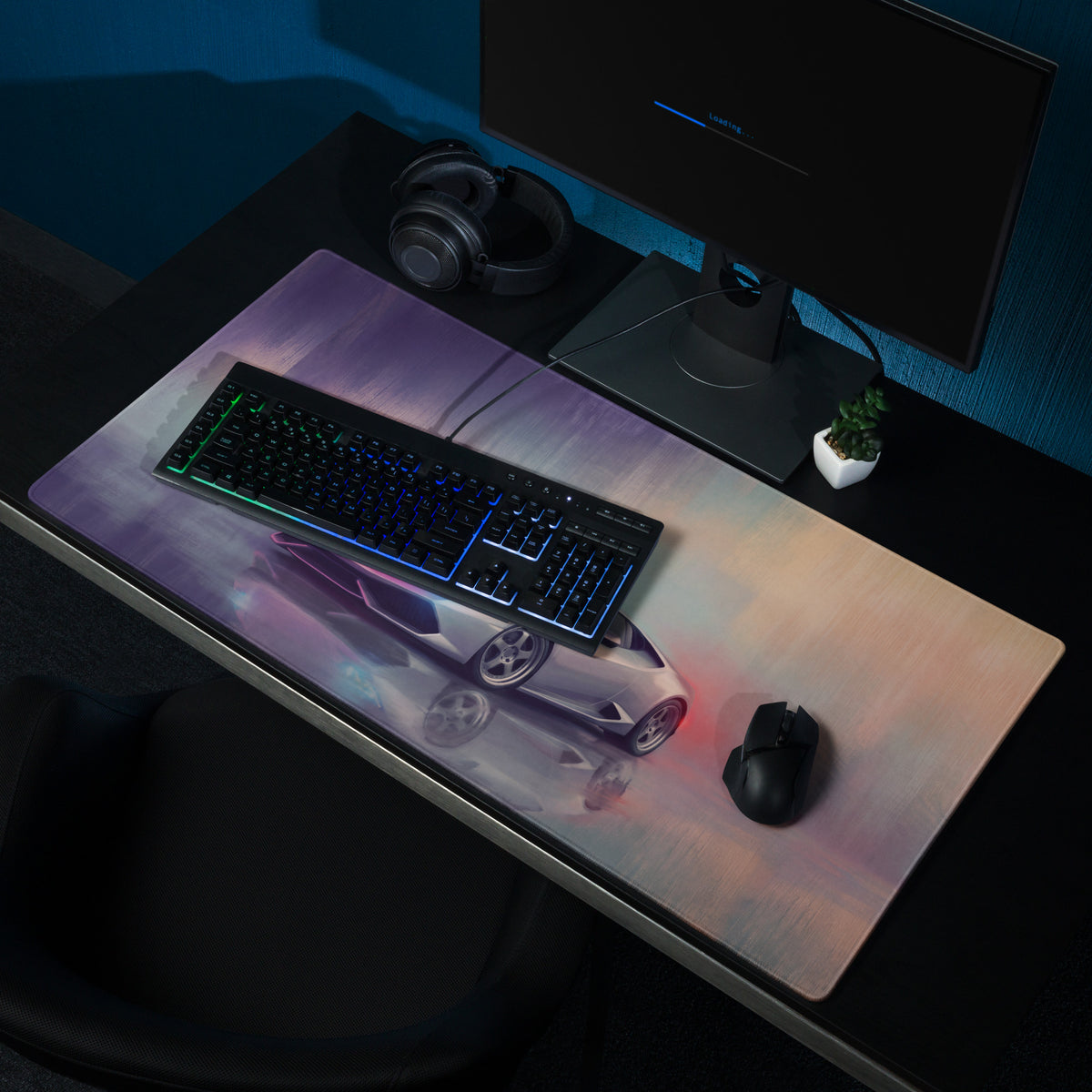 A sleek rectangular ultra-glide cloth gaming mousepad with a vibrant gradient and silver Lamborghini Huracán image under neon lights