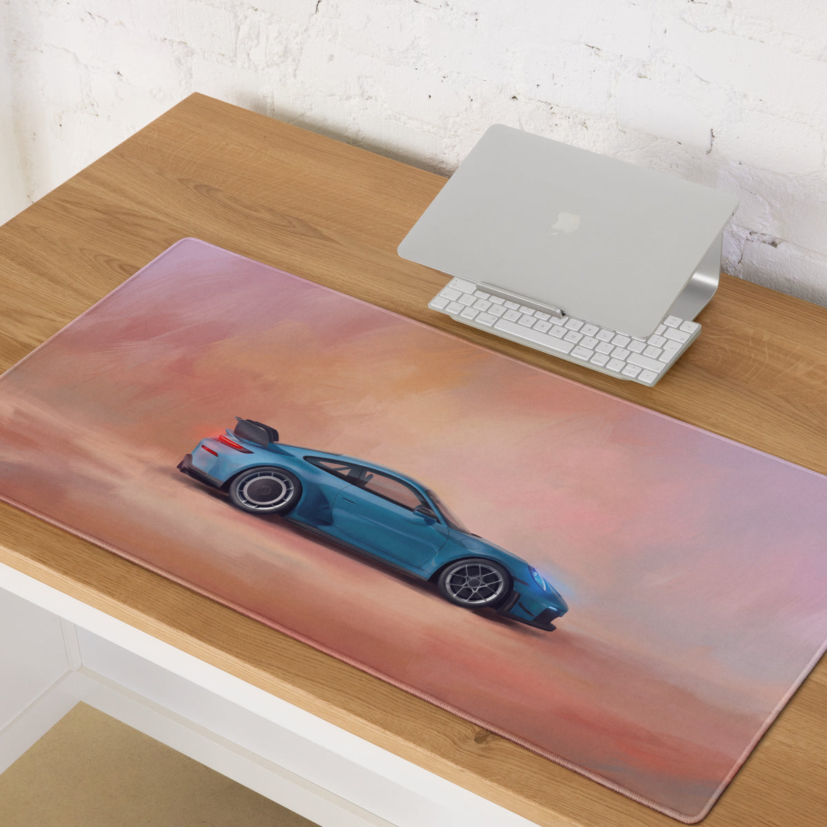 Blue sports car illustration on soft rectangular mousepad with pink and orange gradient for high precision gaming
