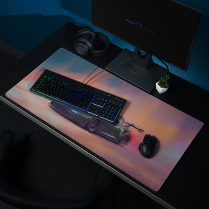 A sleek rectangular gaming mousepad with vibrant pink orange gradient and silver sports car design for pc use