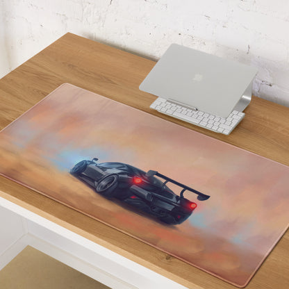 A sleek black sports car graphic on a translucent silicone mousepad with peach gradient for xl gaming use