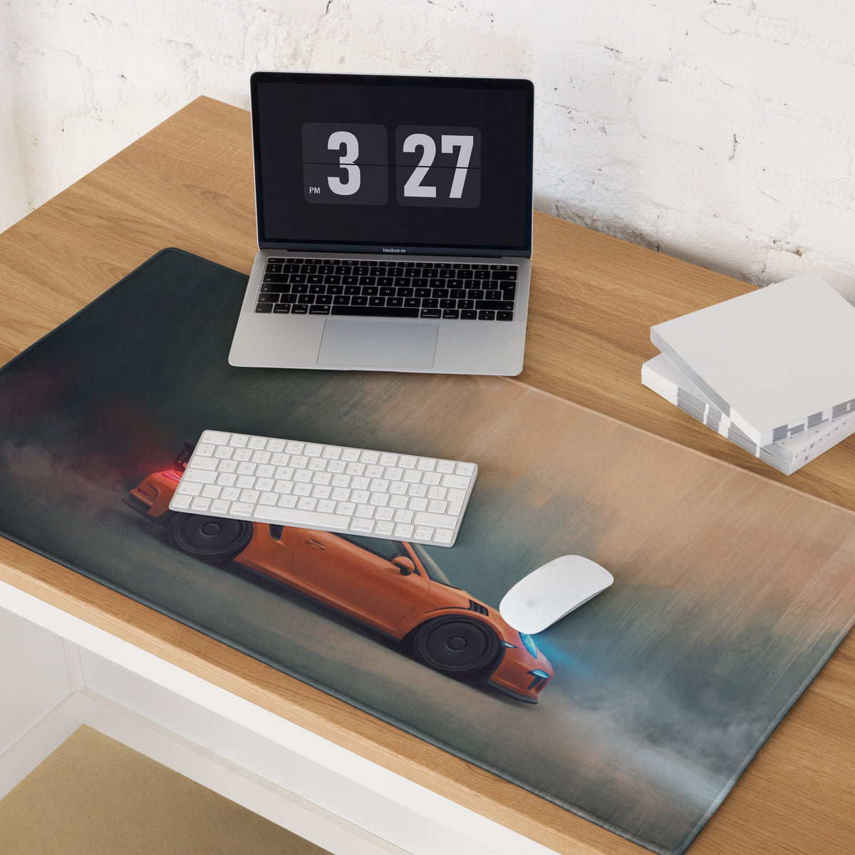 Large rectangular low-friction cloth desk mat featuring an orange Porsche 911 GT3 RS inspired sports car graphic