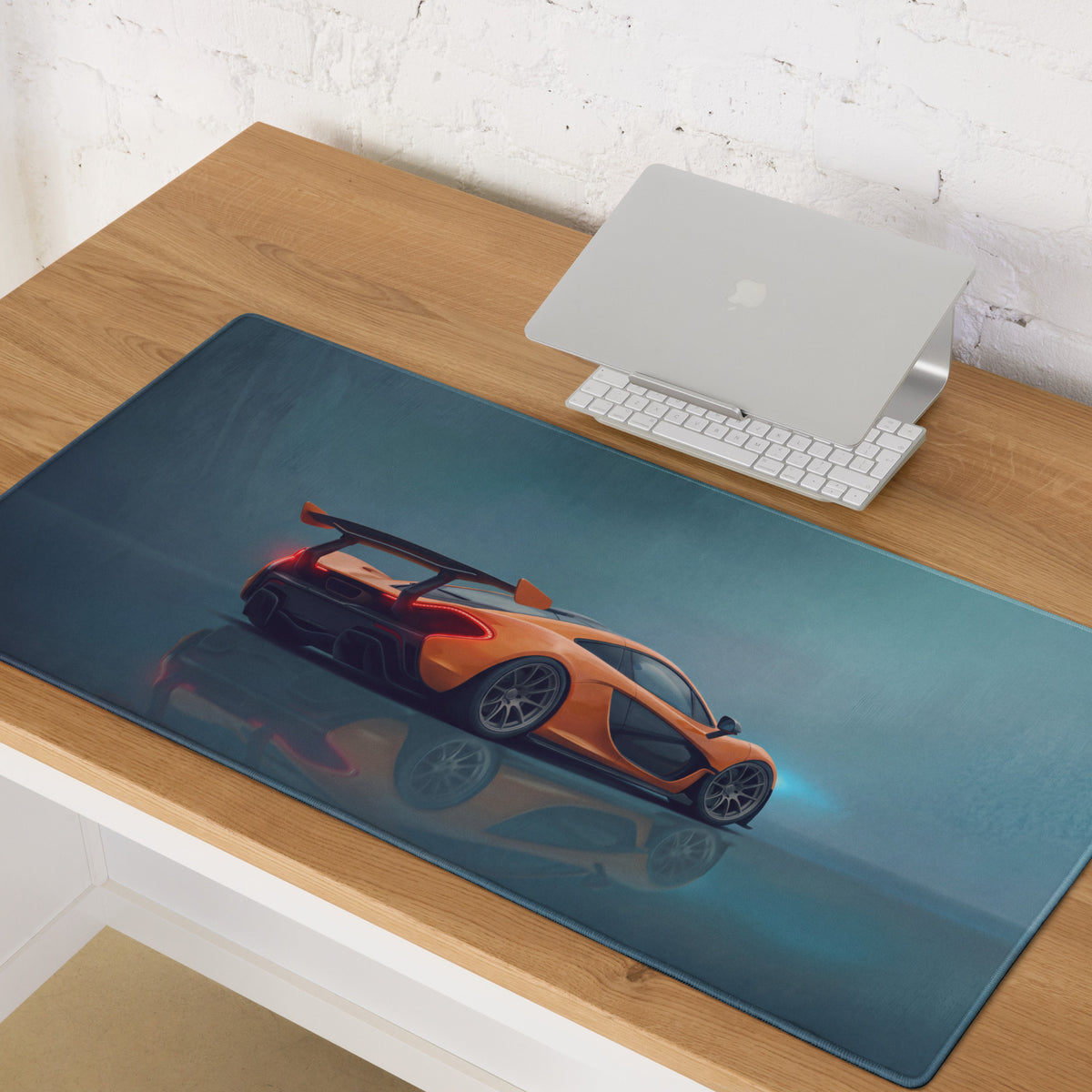 Orange mclaren sports car graphic printed on dark teal low-friction cloth mclaren p1 inspired volcano orange desk mat