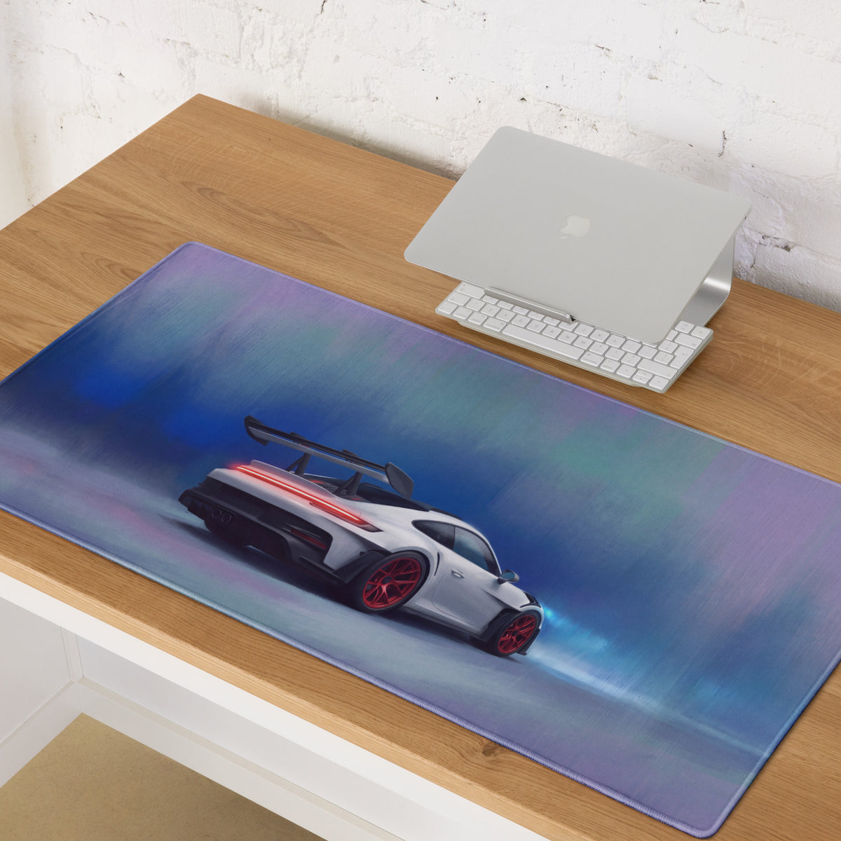 A sleek rectangular ultra-glide gaming mousepad with stitched edges featuring a white Porsche 911 with red wheels