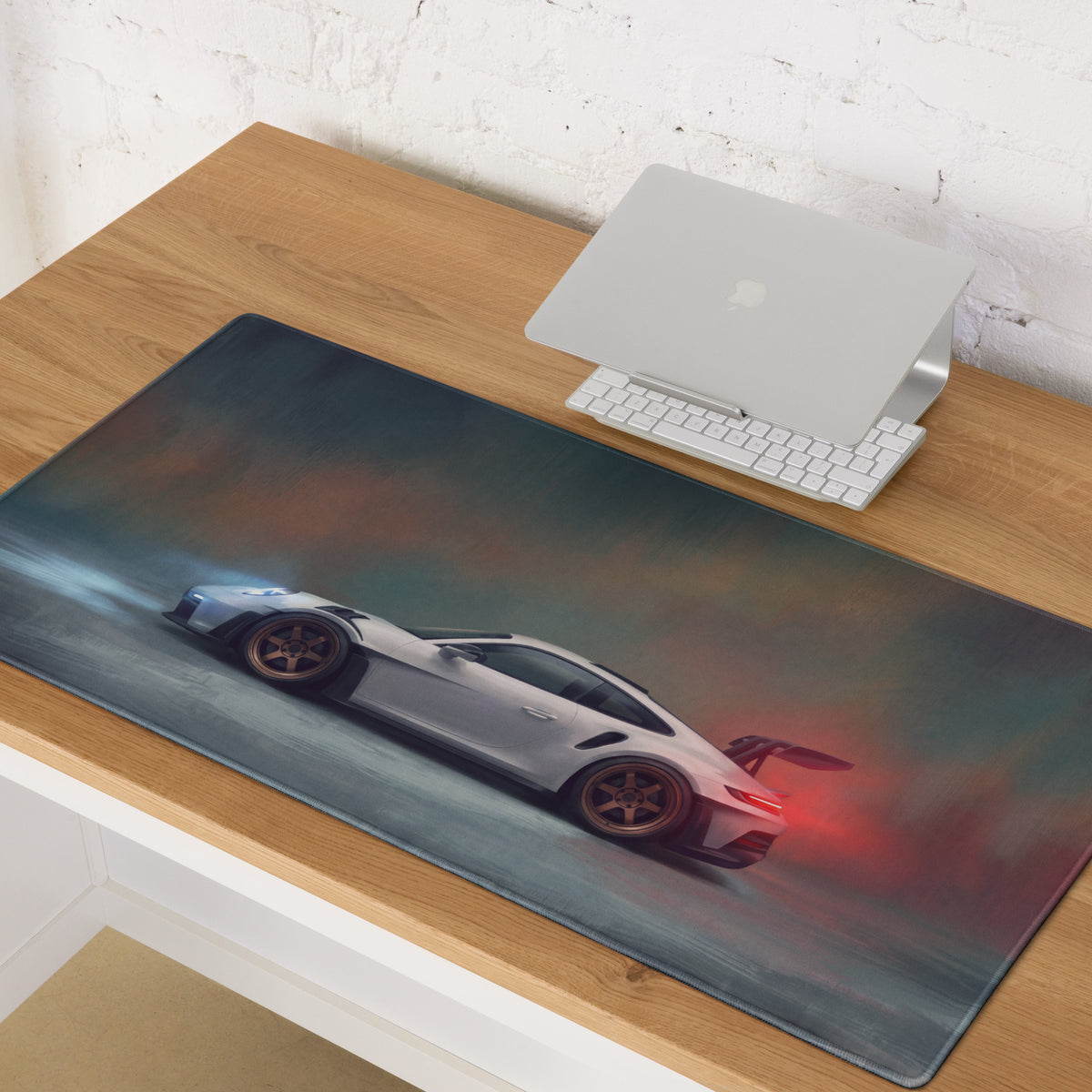 A sleek white Porsche 911 GT3 RS inspired chalk desk pad with soft texture and subtle gray and red accents