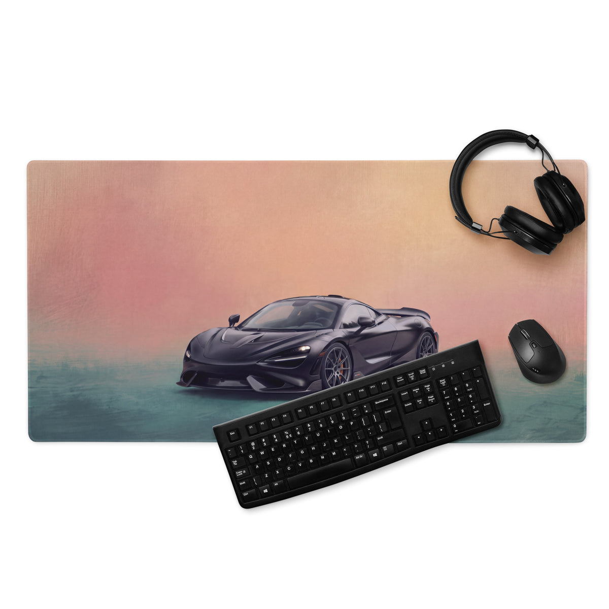 Black mclaren sports car graphic printed on a low friction cloth desk mat with pink and teal gradient background