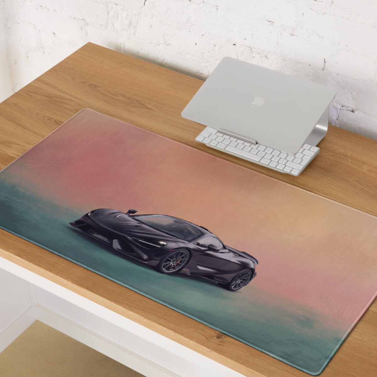 McLaren 765LT inspired stealth onyx desk mat with sleek black McLaren graphic on soft pink and teal gradient cloth mousepad