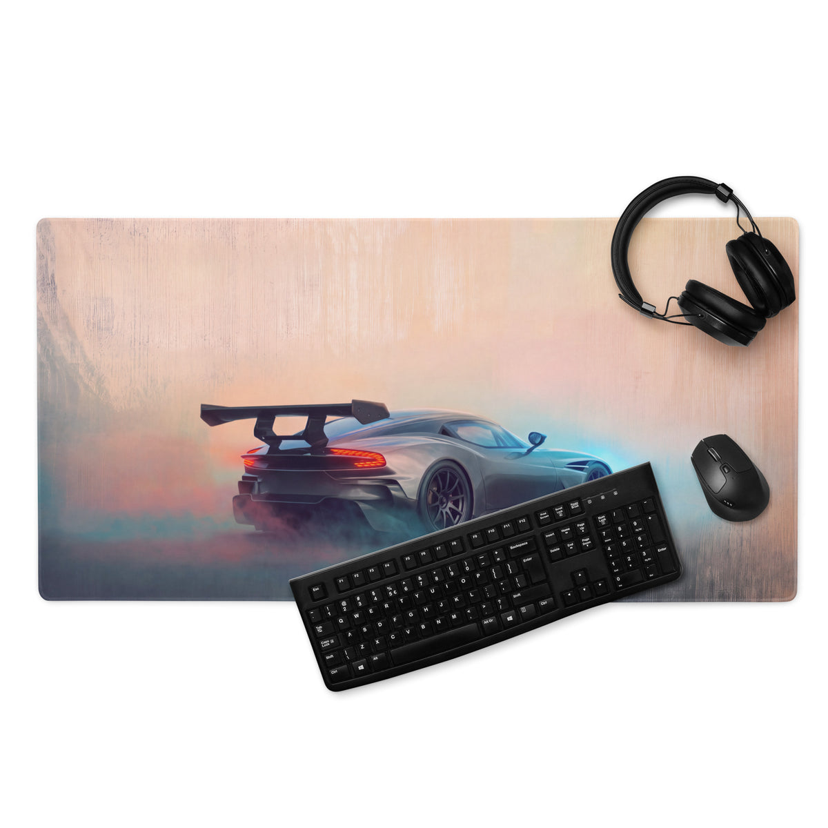 A sleek matte finish gunmetal gaming mousepad with stitched edges featuring a silver aston martin vulcan sports car graphic