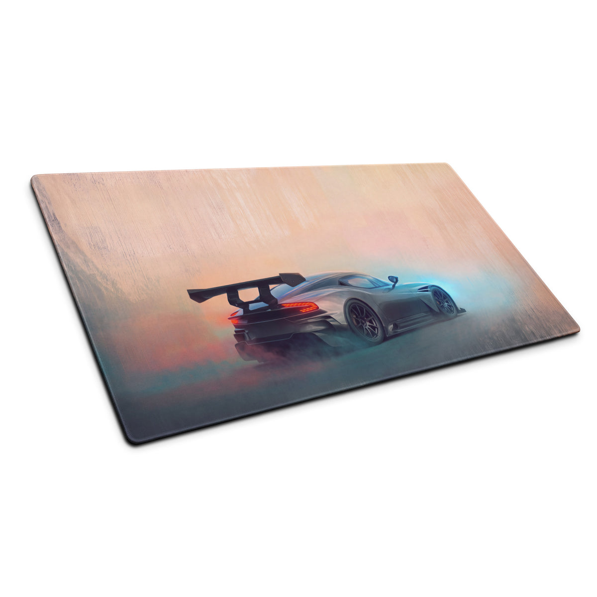 Rectangular gunmetal apex desk pad with stitched edges featuring an aston martin vulcan sports car design