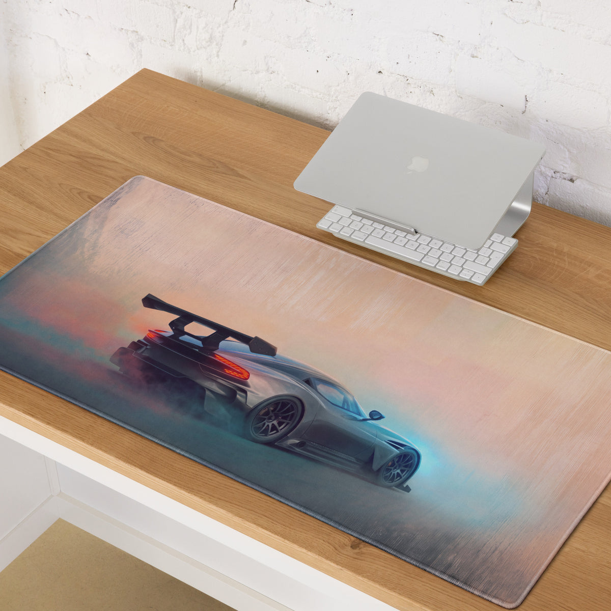 Aston Martin Vulcan inspired gunmetal apex desk pad with stitched edges featuring a silver sports car design