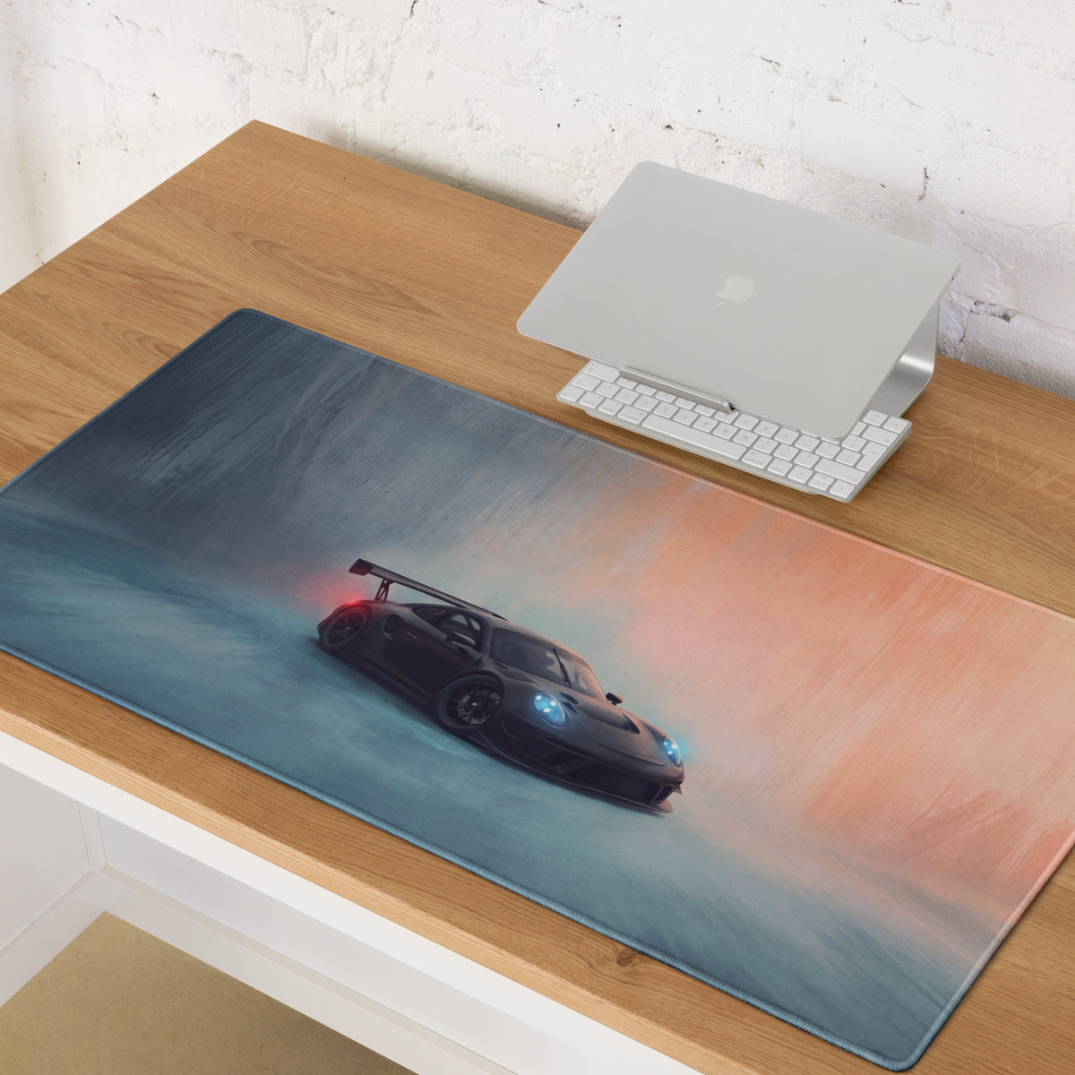 A sleek black porsche 911 gt3 inspired stealth shadow desk mat with glowing headlights on a low-friction cloth mousepad