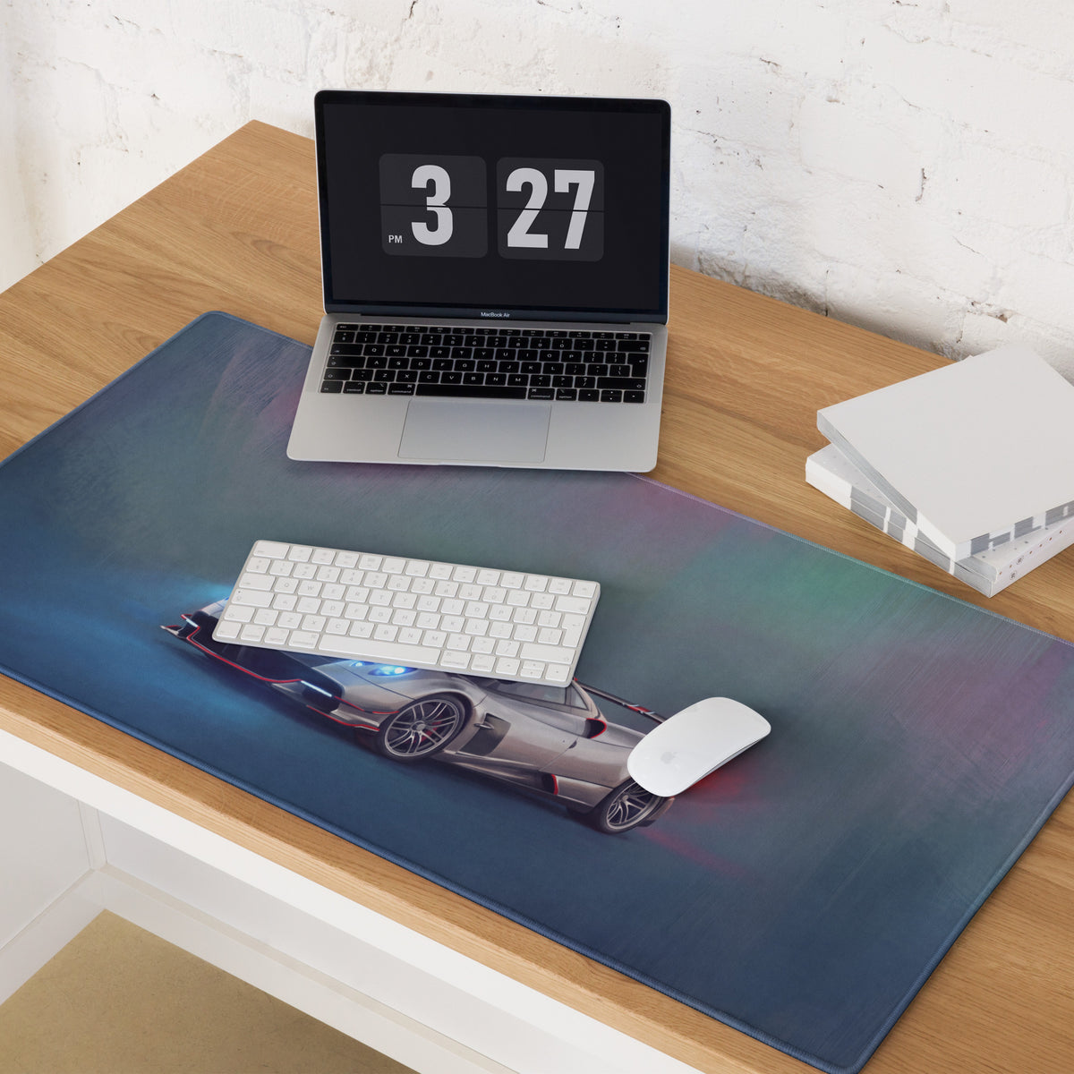 A sleek rectangular xl gaming mousepad with a vibrant gradient and silver Pagani Huayra sports car design