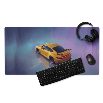 Vibrant yellow Porsche 911 GT3 inspired speed desk pad with ultra-glide stitched edge and gradient purple blue background