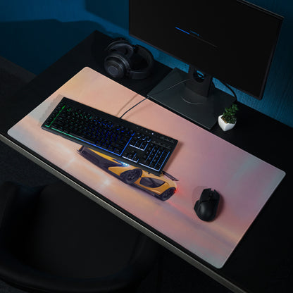 A sleek rectangular low-friction cloth gaming mousepad featuring a yellow and black McLaren P1 inspired sports car design