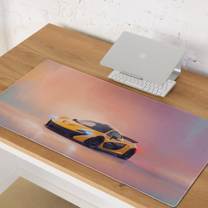 A sleek low-friction cloth gaming mousepad featuring a yellow and black mclaren p1 design on a sunset backdrop