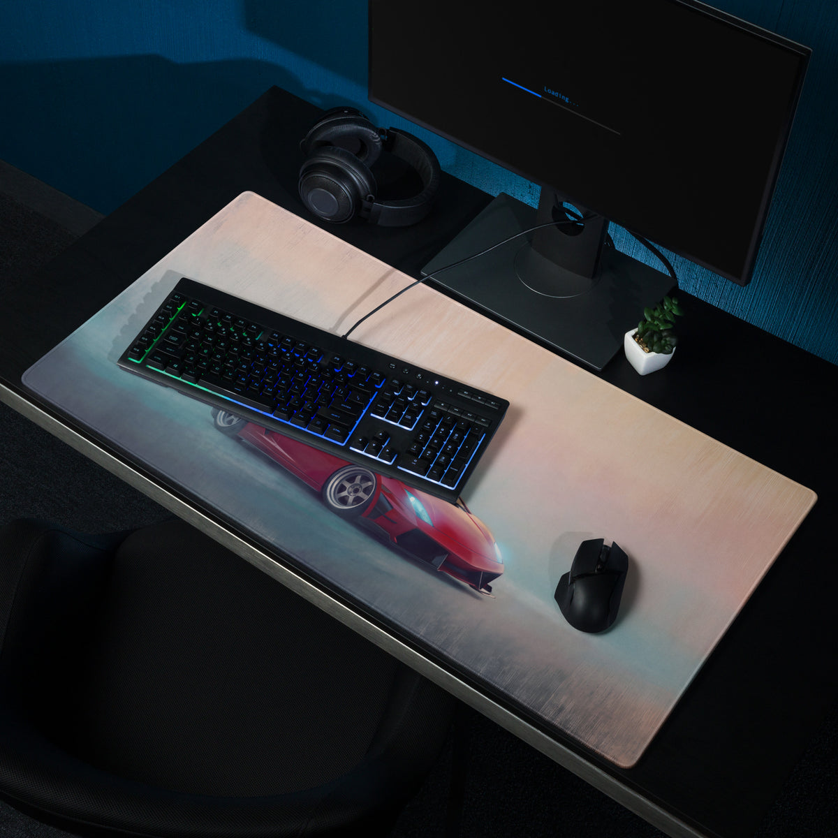 Red sports car graphic on a sleek rosso corsa cloth desk mat with low-friction edges for smooth mouse control