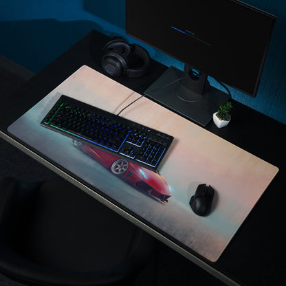 Red sports car graphic on a sleek rosso corsa cloth desk mat with low-friction edges for smooth mouse control