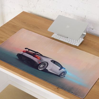 A sleek rectangular pearl apex desk pad featuring a white Lamborghini Huracán with red taillights and blue flames