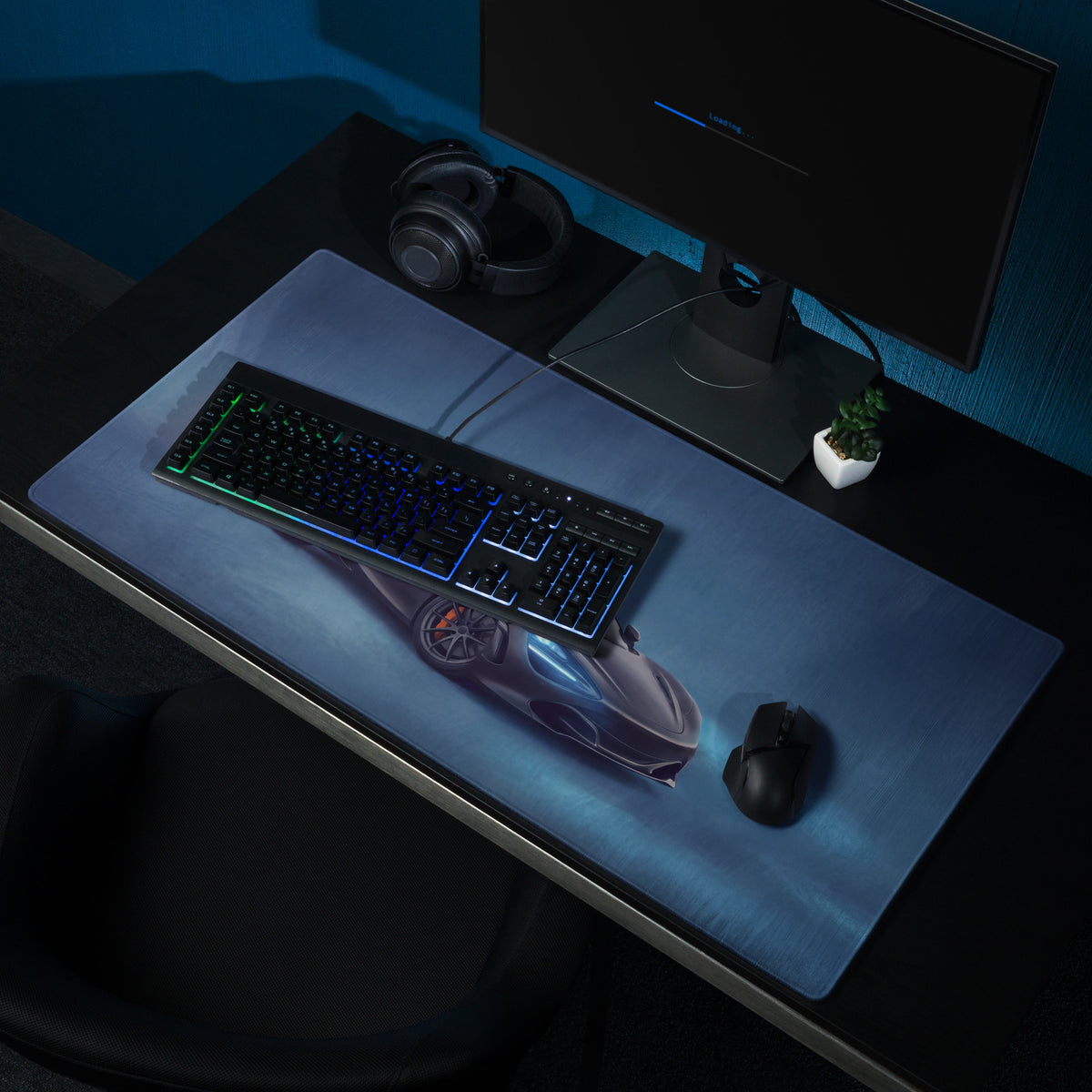 A sleek dark blue gaming mousepad with glossy futuristic sports car print for high precision xl gaming use