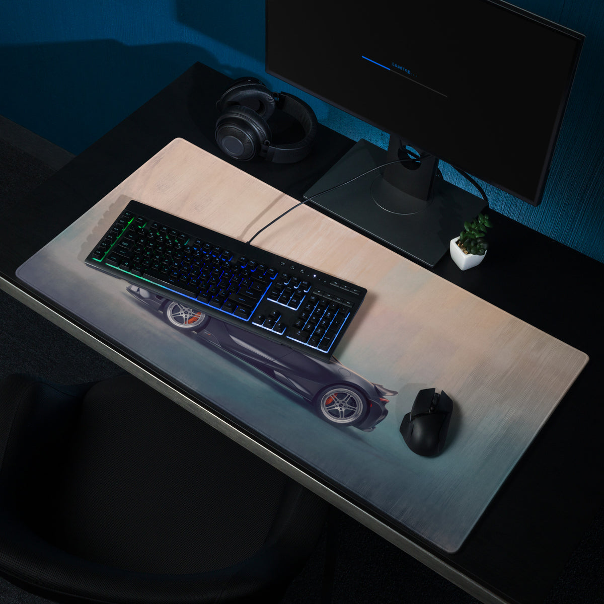 A sleek dark gray McLaren 765LT inspired carbon profile desk mat with a smooth low-friction cloth surface and racing car graphic