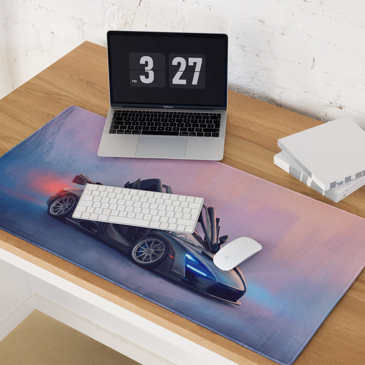 A sleek rectangular low-friction cloth gaming mousepad featuring a futuristic black McLaren Senna car graphic