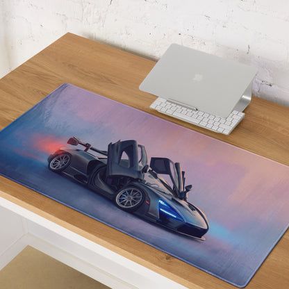 McLaren Senna inspired stealth dihedral desk mat with dark gray sports car and purple pink sky on low friction cloth mousepad