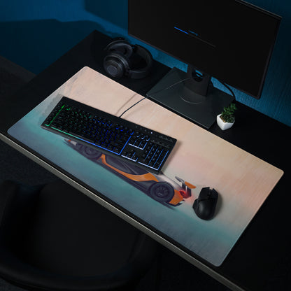 A sleek rectangular low-friction cloth gaming mousepad with a vibrant orange and black mclaren p1 sports car graphic