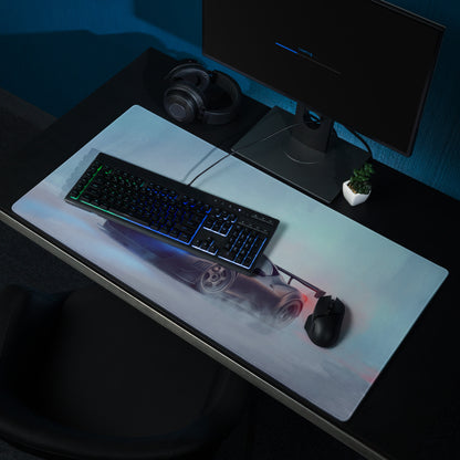 A sleek matte black extended non-slip gaming mousepad featuring a silver sports car with glowing blue and red accents