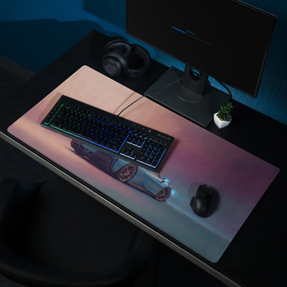 A sleek rectangular low-friction cloth gaming mousepad with a pink and blue gradient and illuminated silver sports car design