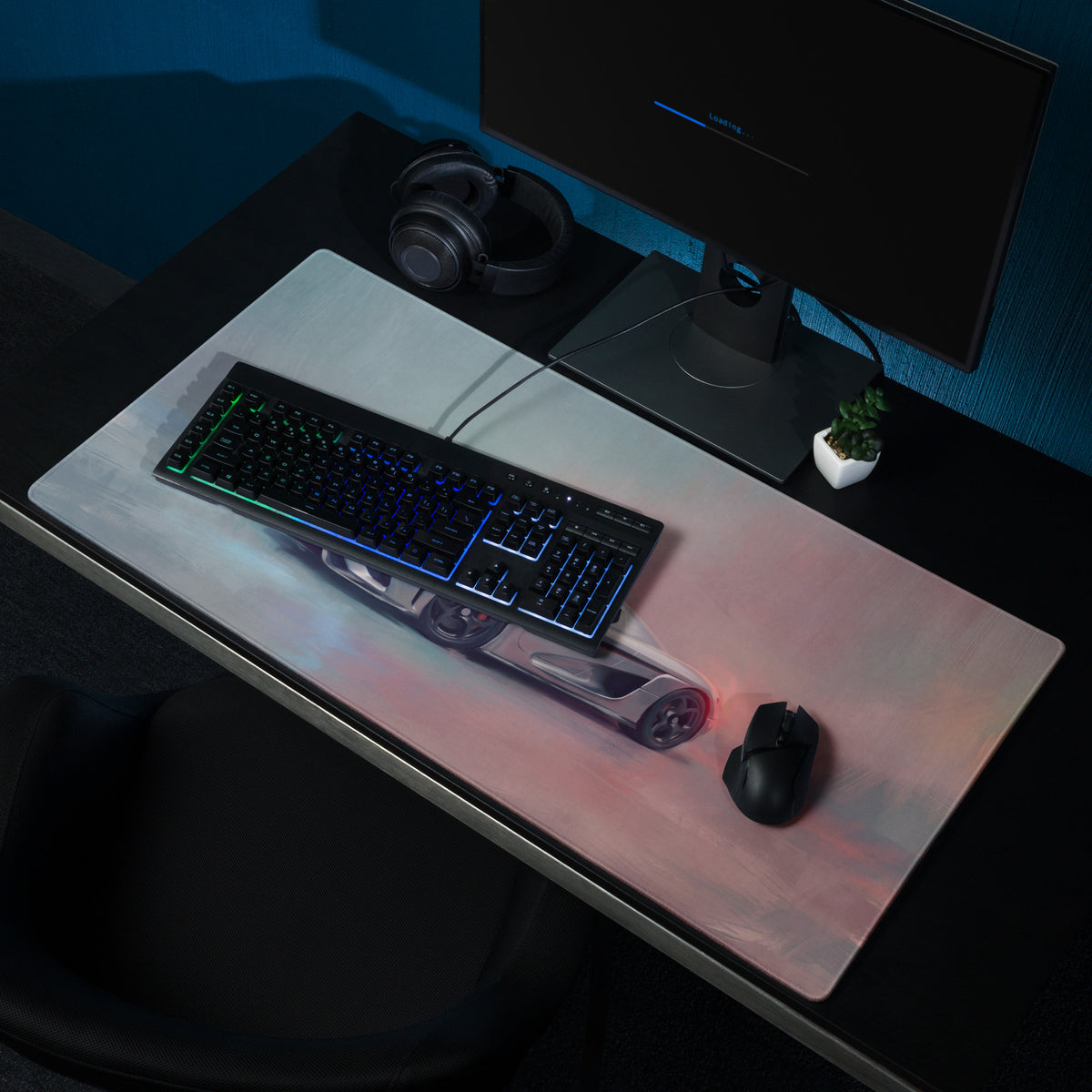 A sleek rectangular high-precision xl gaming mousepad with glossy finish and illuminated silver Koenigsegg Regera car design