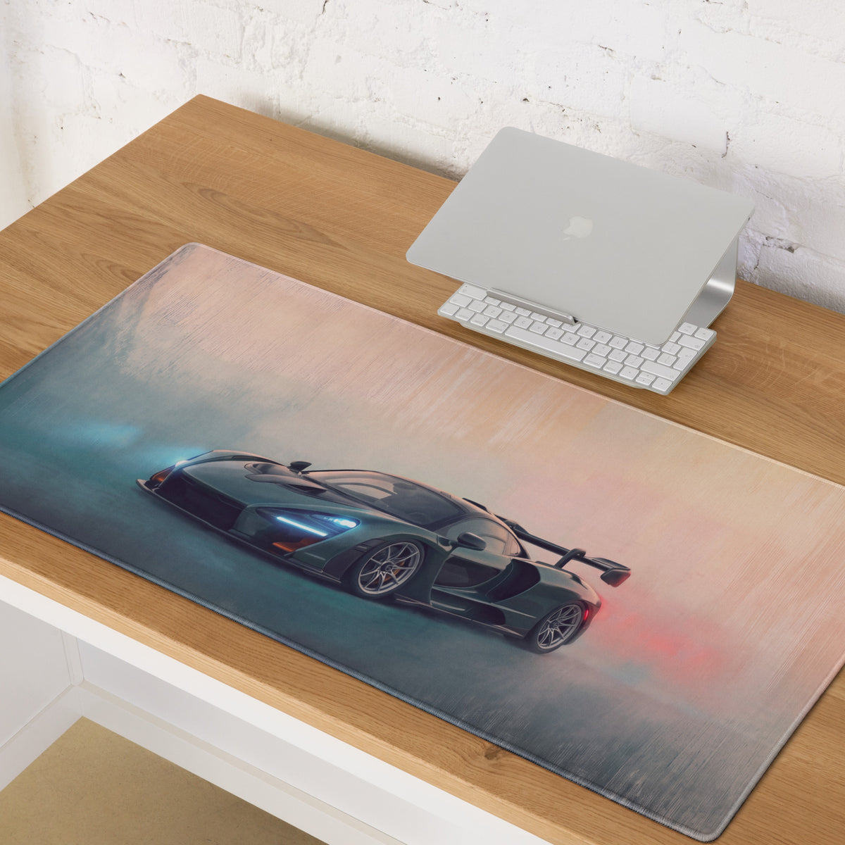 A sleek dark teal mclaren senna inspired sports car graphic on a british racing green low-friction cloth desk mat