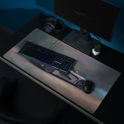 A sleek rectangular silver gaming mousepad with a detailed koenigsegg regera sports car graphic and red accents