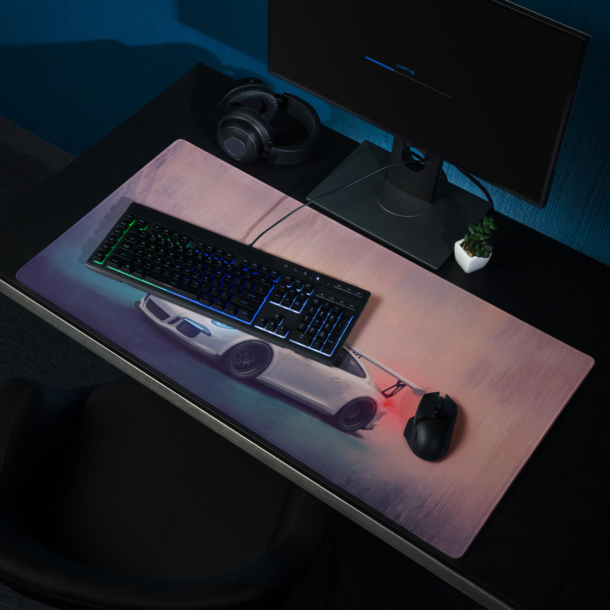 A sleek rectangular gaming mousepad with a stitched edge featuring a white Porsche 911 gt3 inspired graphic