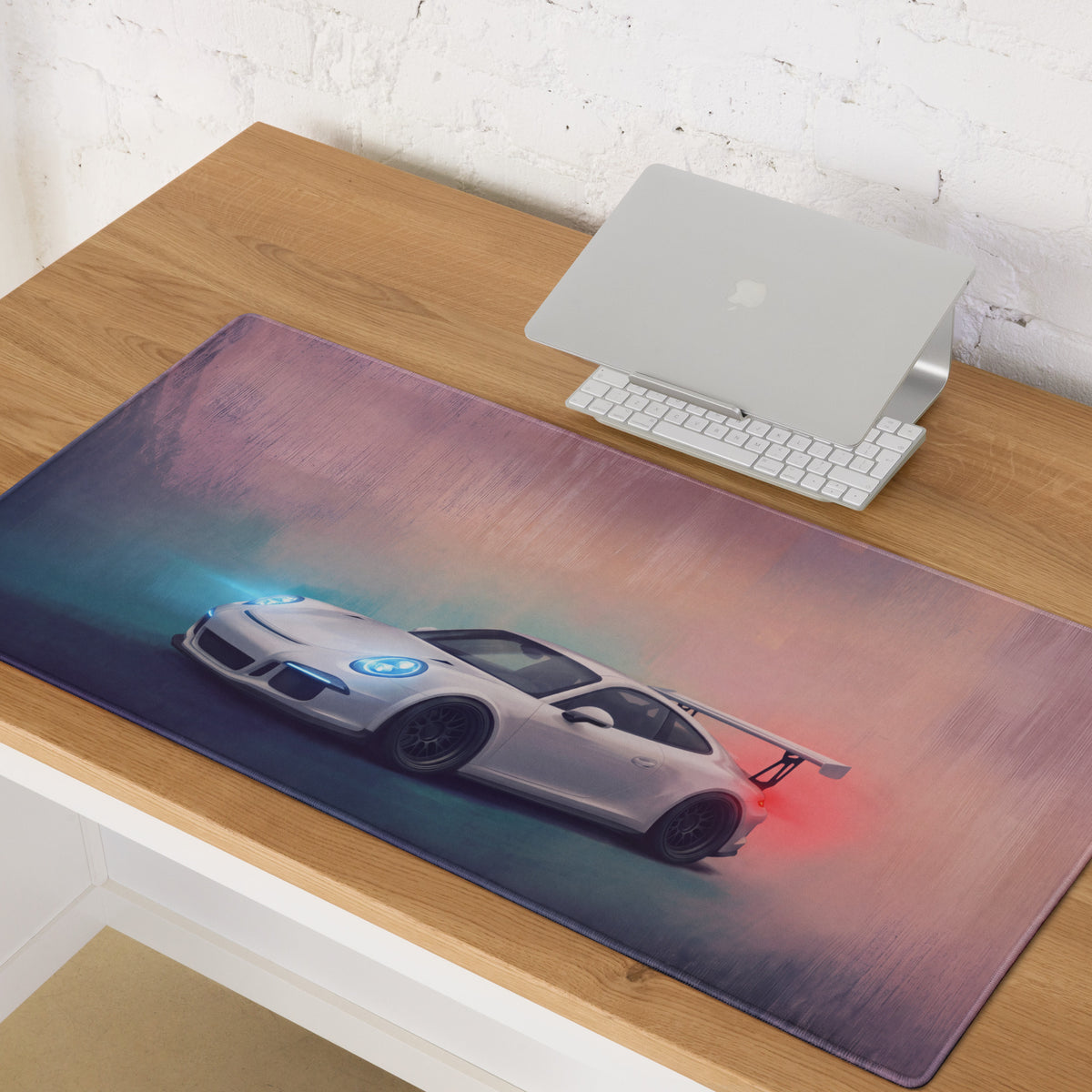 A sleek white porsche 911 gt3 inspired desk pad with stitched edge and vibrant purple teal gradient background