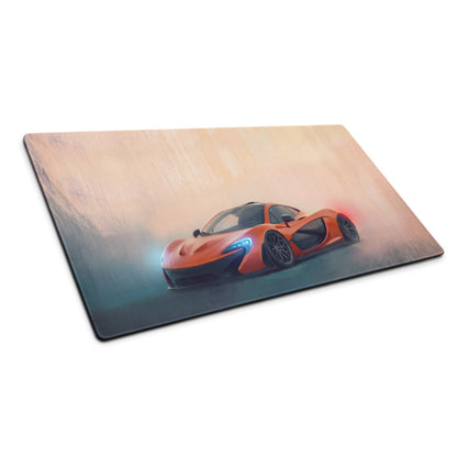 Orange McLaren P1 sports car graphic printed on a glossy rectangular volcano horizon desk pad with stitched edges