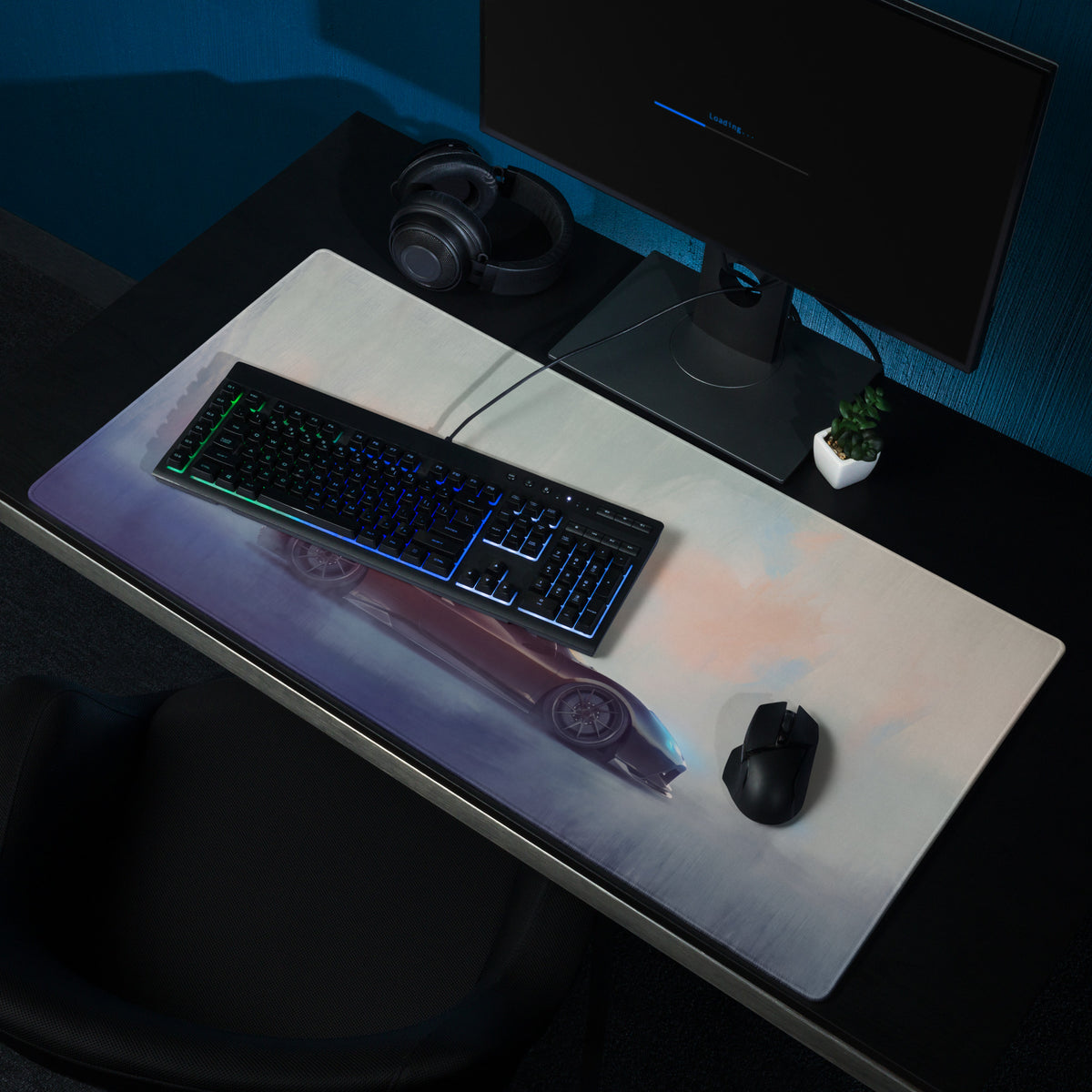 A sleek rectangular charcoal drift desk pad with a vibrant red sports car gradient for gaming and PC use