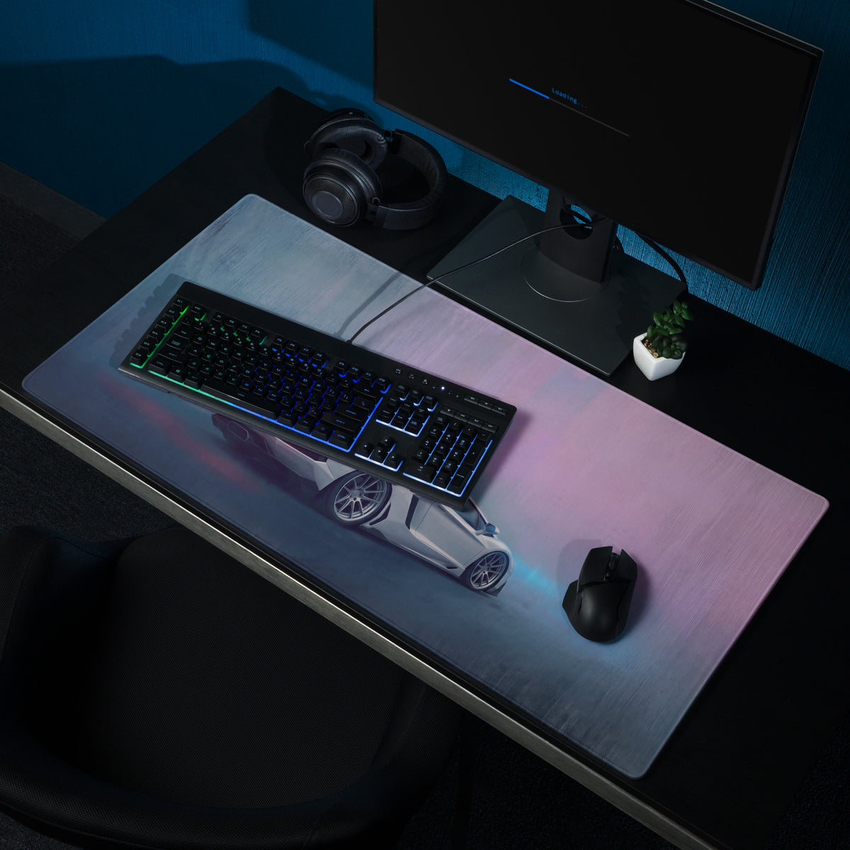 A sleek xl gaming mousepad featuring a detailed white sports car graphic with blue and purple lighting effects