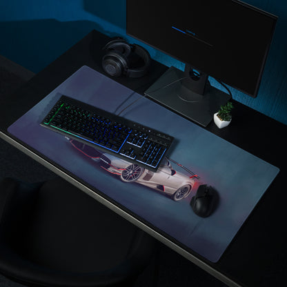 A sleek rectangular silver crimson desk mat with low-friction cloth and a white and red Pagani Huayra inspired sports car graphic